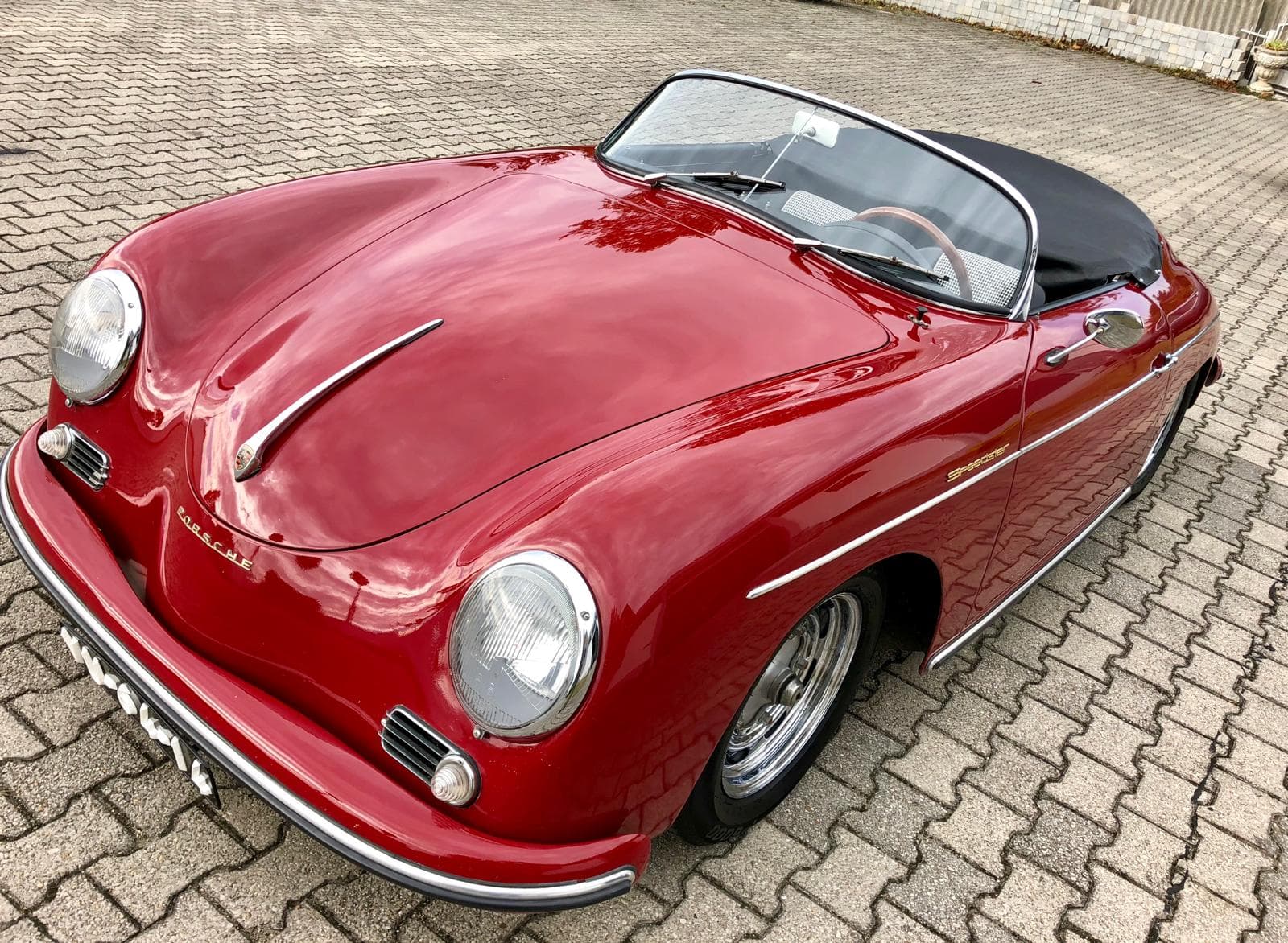 Red Porsche 356 Speedster convertible after full detailing
