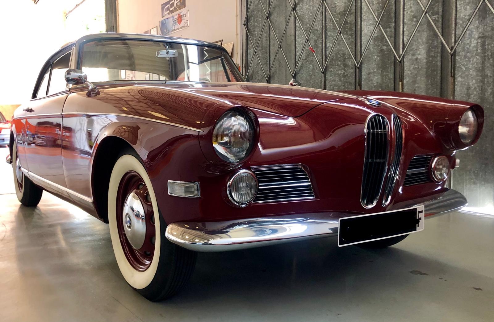 Burgundy vintage BMW 503 with white wall tires after full detail