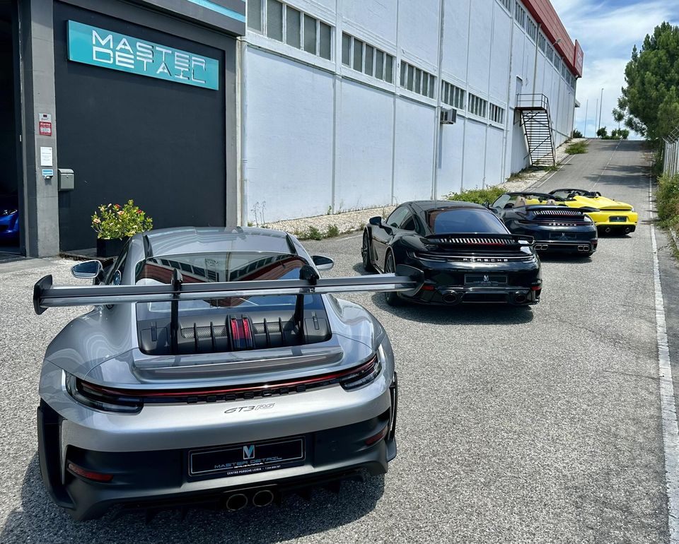 Multiple Porsches lined up for detailing service