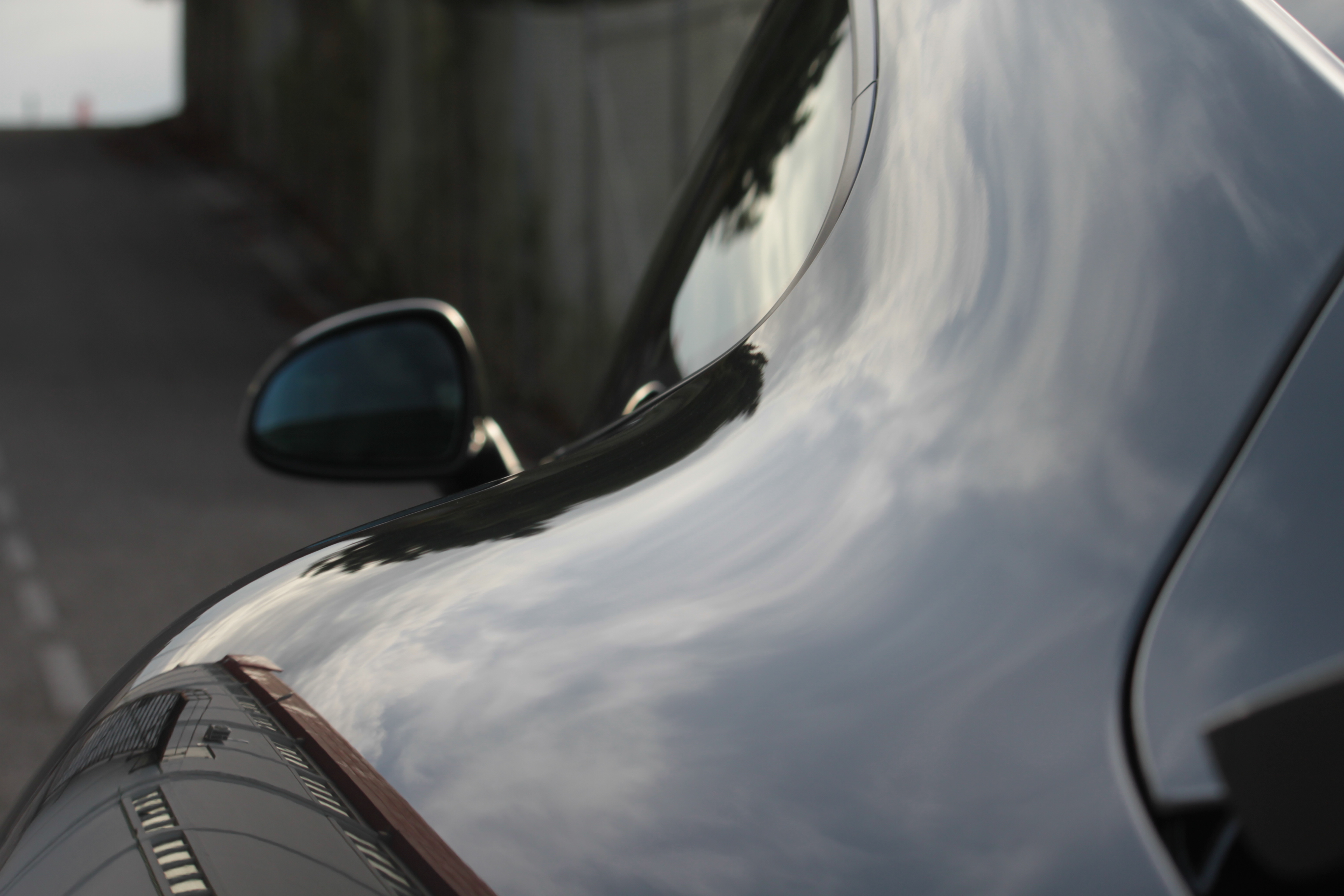 Porsche paint correction showing mirror-like reflections